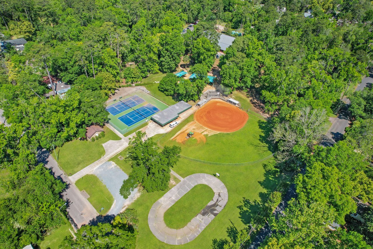 An aerial view of Lafayette Park, highlighting the recreational facilities, including a baseball field and playground.