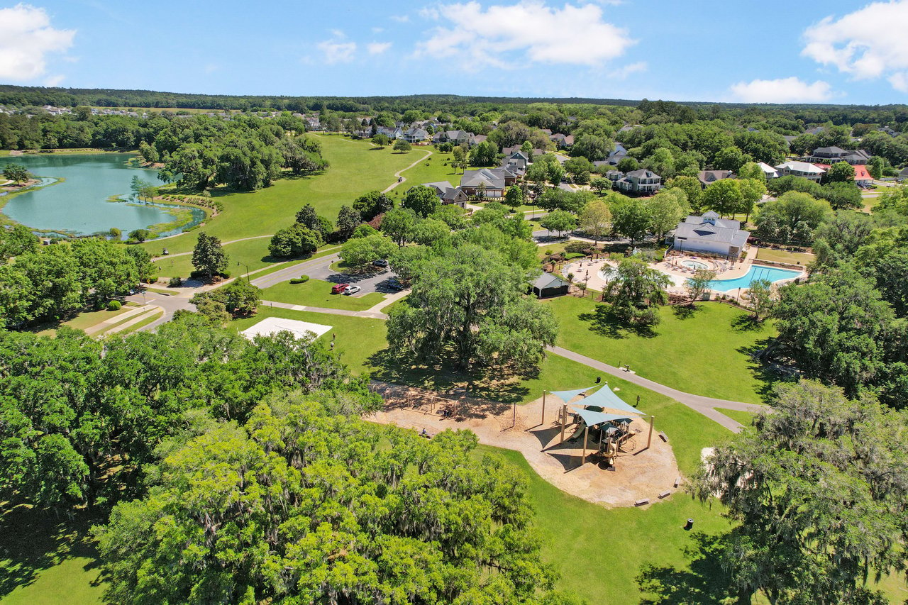 An aerial view of the Southwood neighborhood, showcasing houses, green spaces, and a central recreational area with playground equipment.