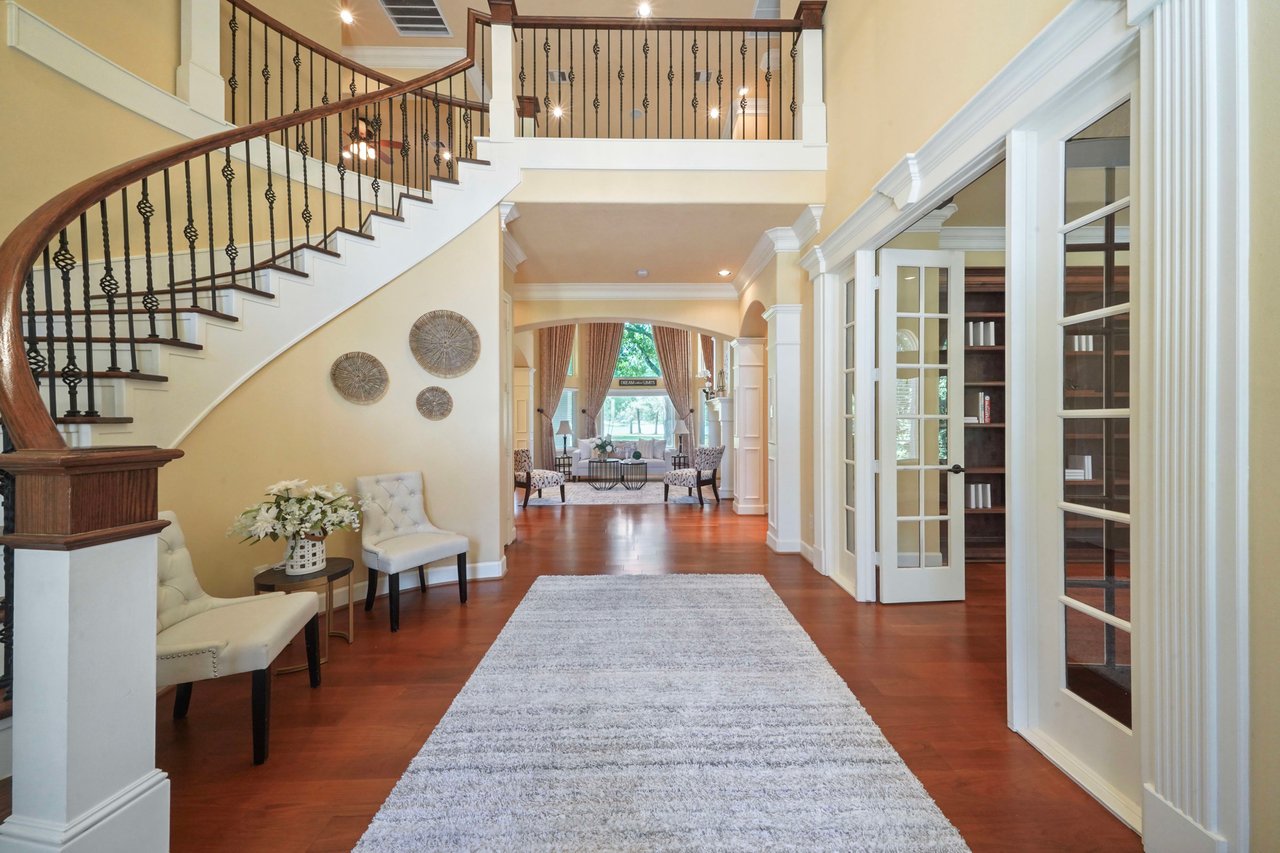 Imported Burma Teak flooring greets you in the formal entry and leads you throughout the first floor living spaces. It provides a warm contrast to the light walls and woodwork/trim.