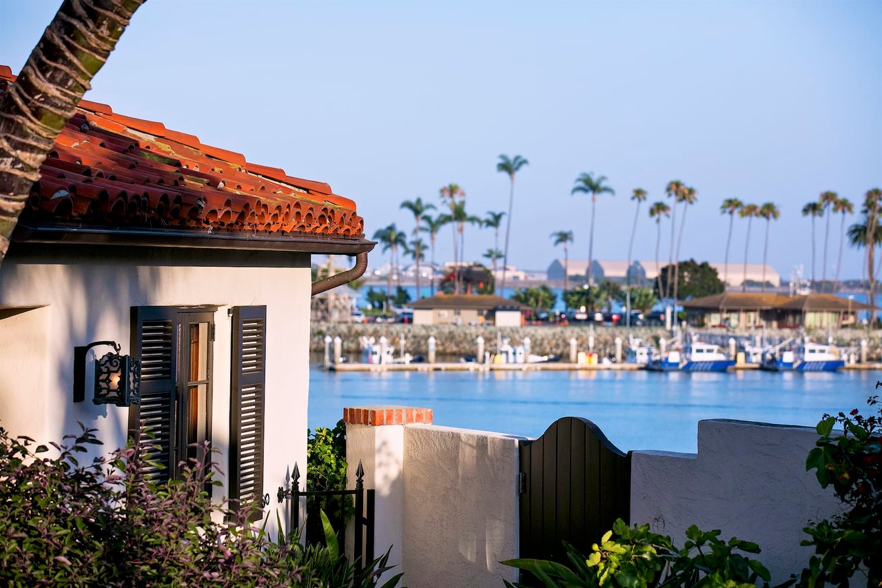 Waterfront view from La Playa in Point Loma, San Diego, with calm bay water and docked boats.