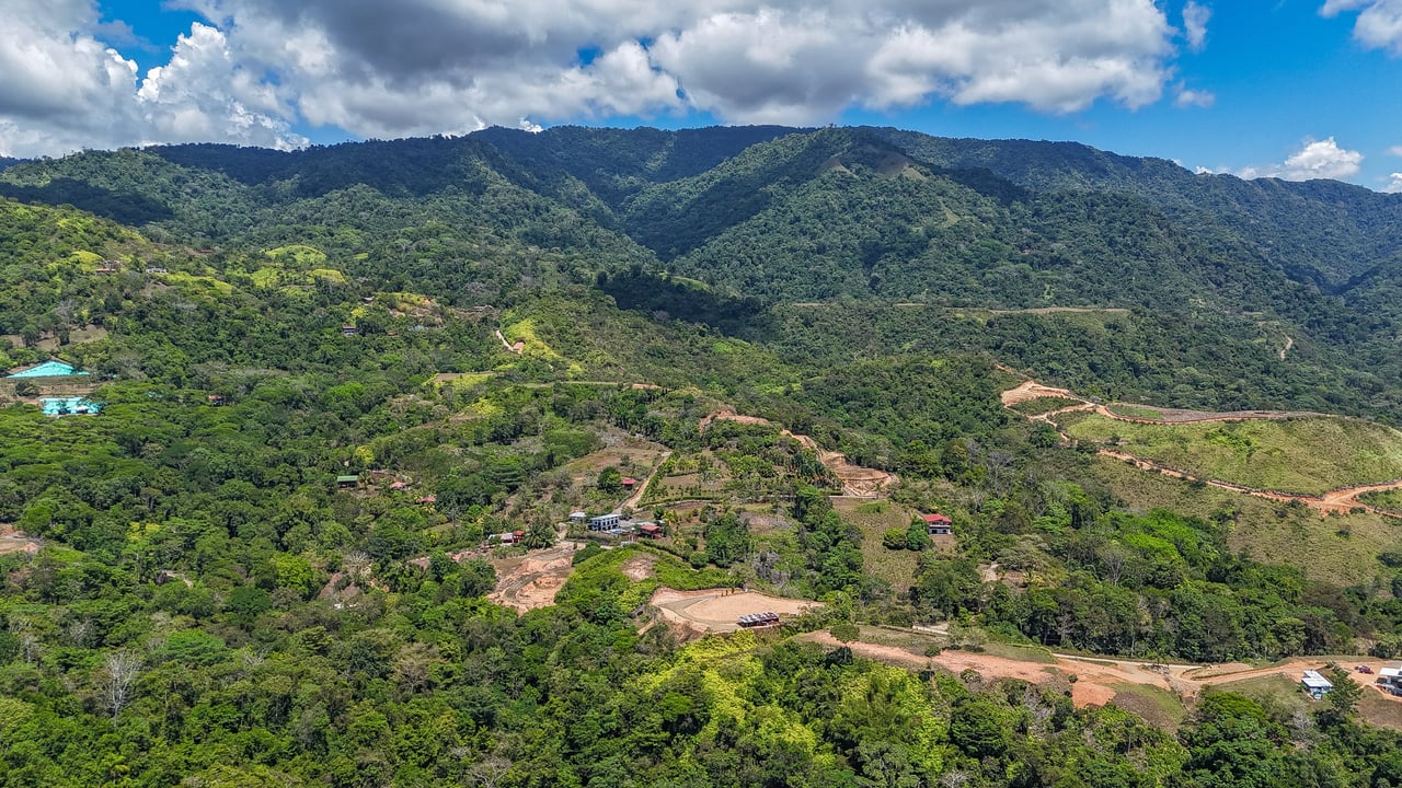 An elevated, prepared river lot with 360-degree ocean, mountain, valley and jungle views