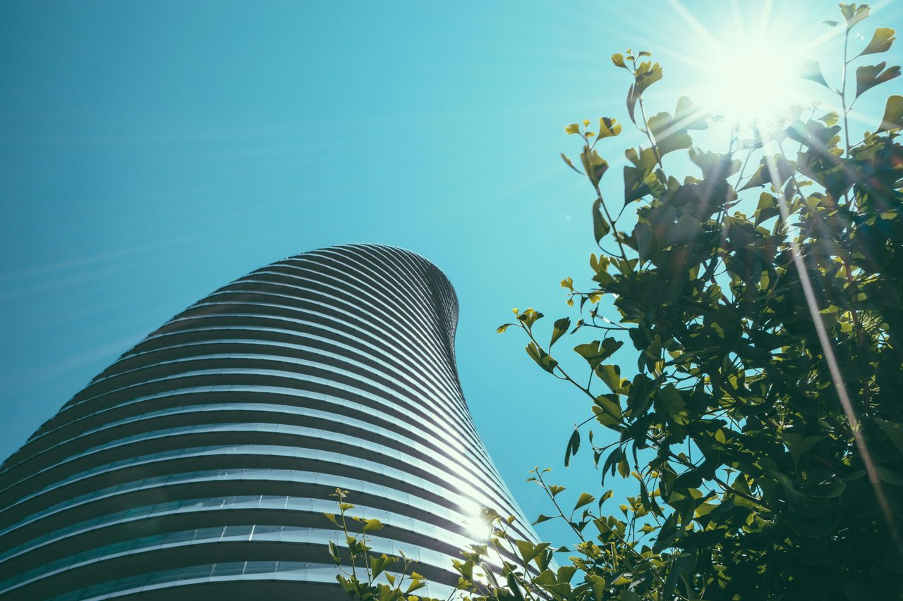 A very tall skyscraper with a curved facade.