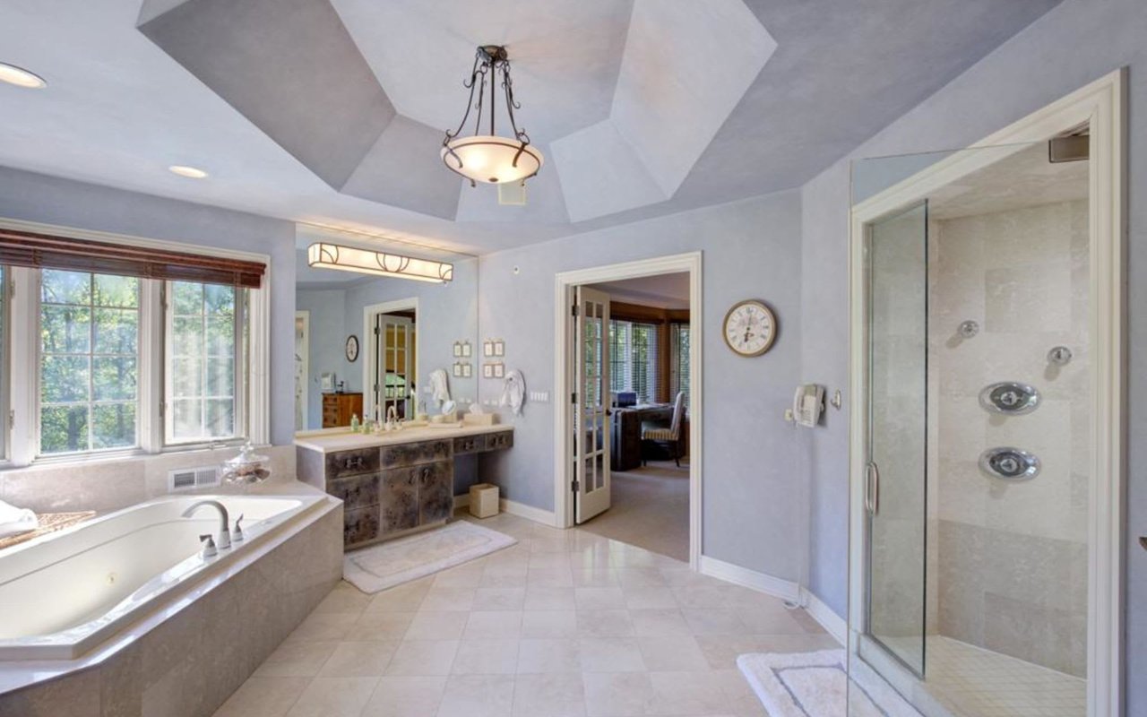 This Stately Brick Traditional Home Is Uniquely Positioned On One Of The Most Private Lots In Royal Melbourne
