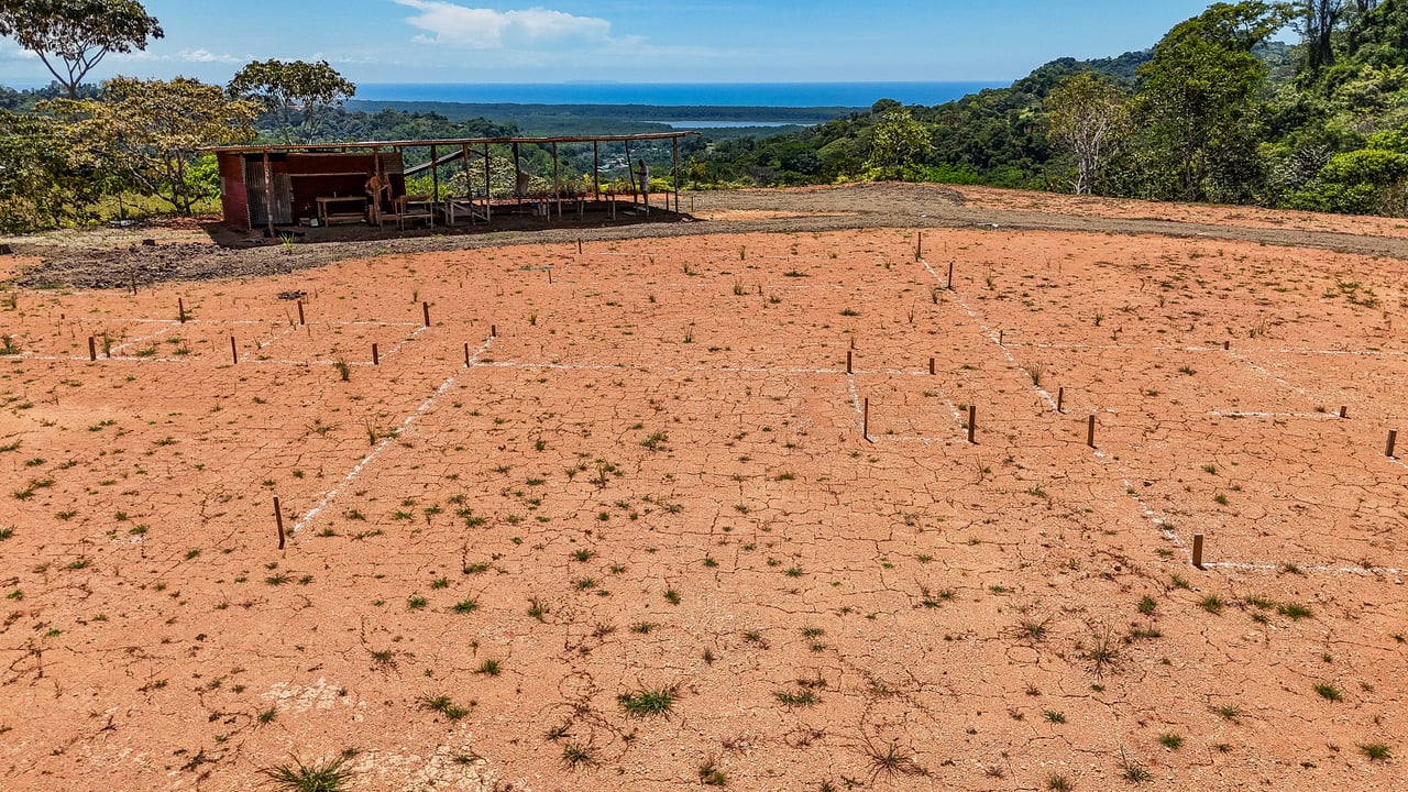 An elevated, prepared river lot with 360-degree ocean, mountain, valley and jungle views