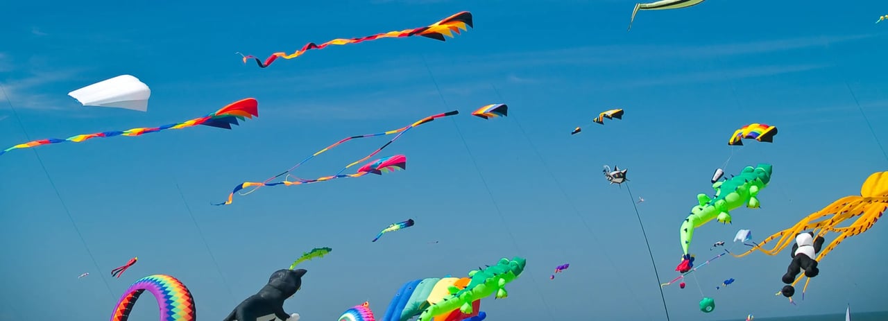 Colorful kites against a clear blue sky in Rockaway Beach Oregon