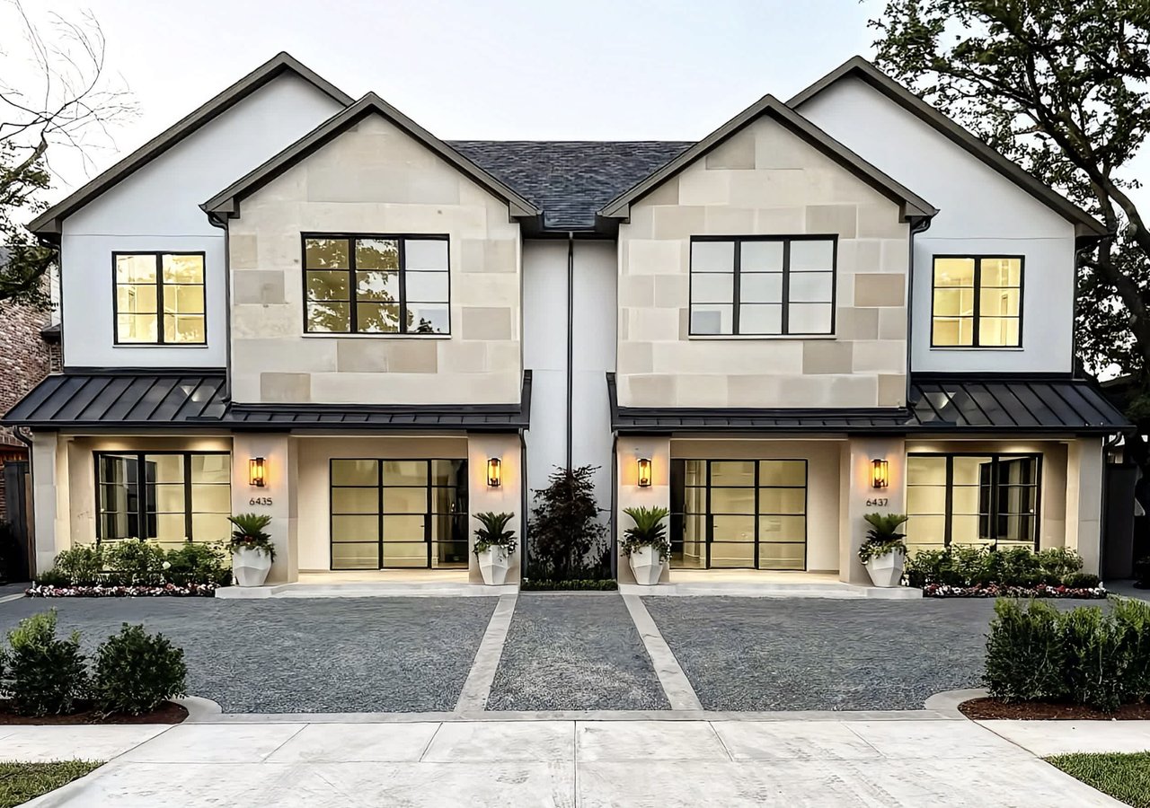 Luxury townhome by S&R Development on Del Norte, featuring modern design, large black-framed windows, and elegant landscaping