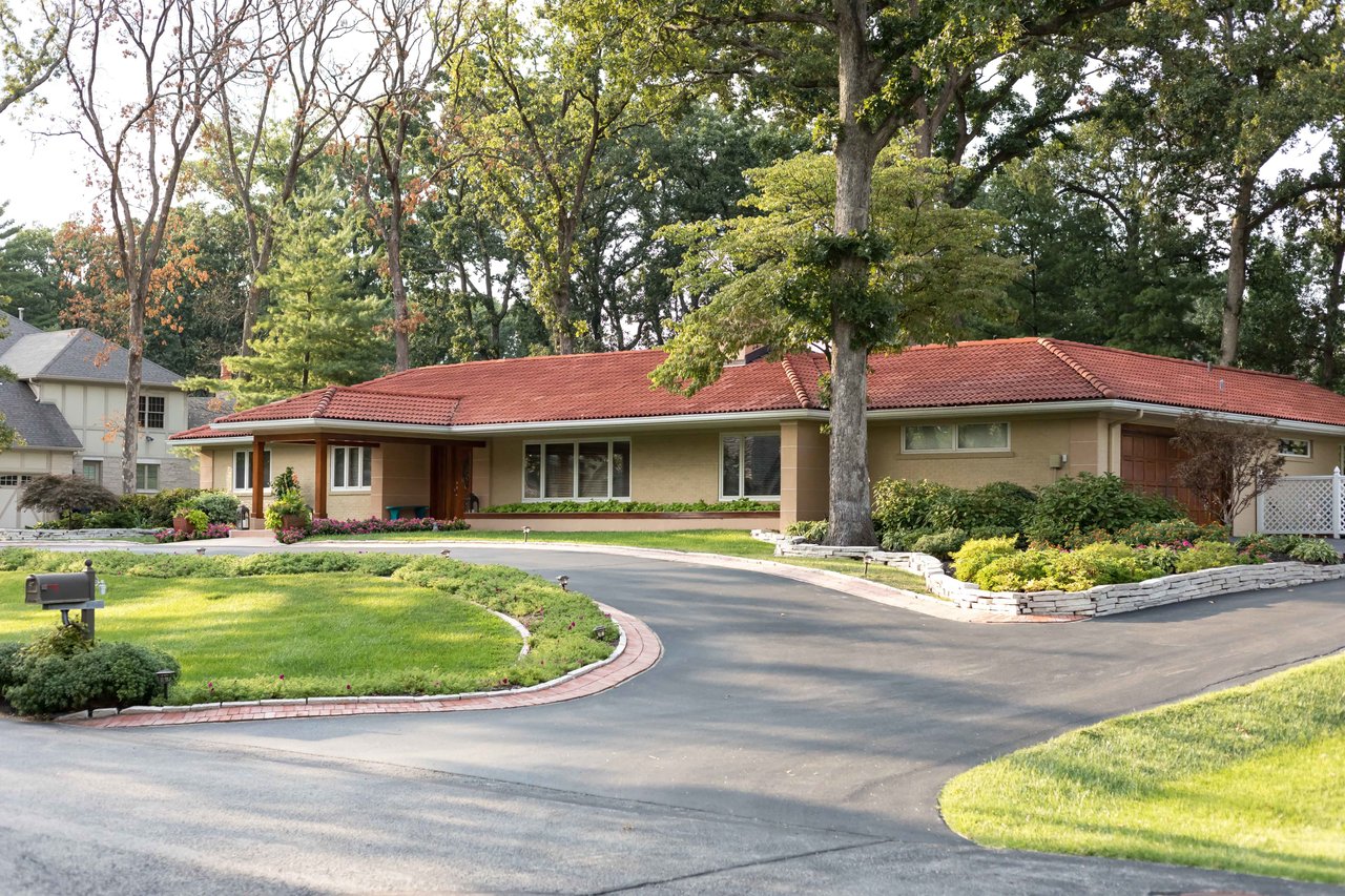 A Special Retreat on a Prized One Acre Lot With Pool and Tennis Court