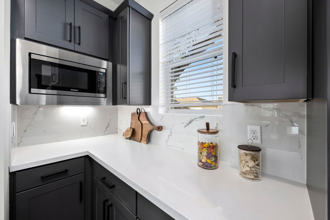 kitchen with white stone countertops 