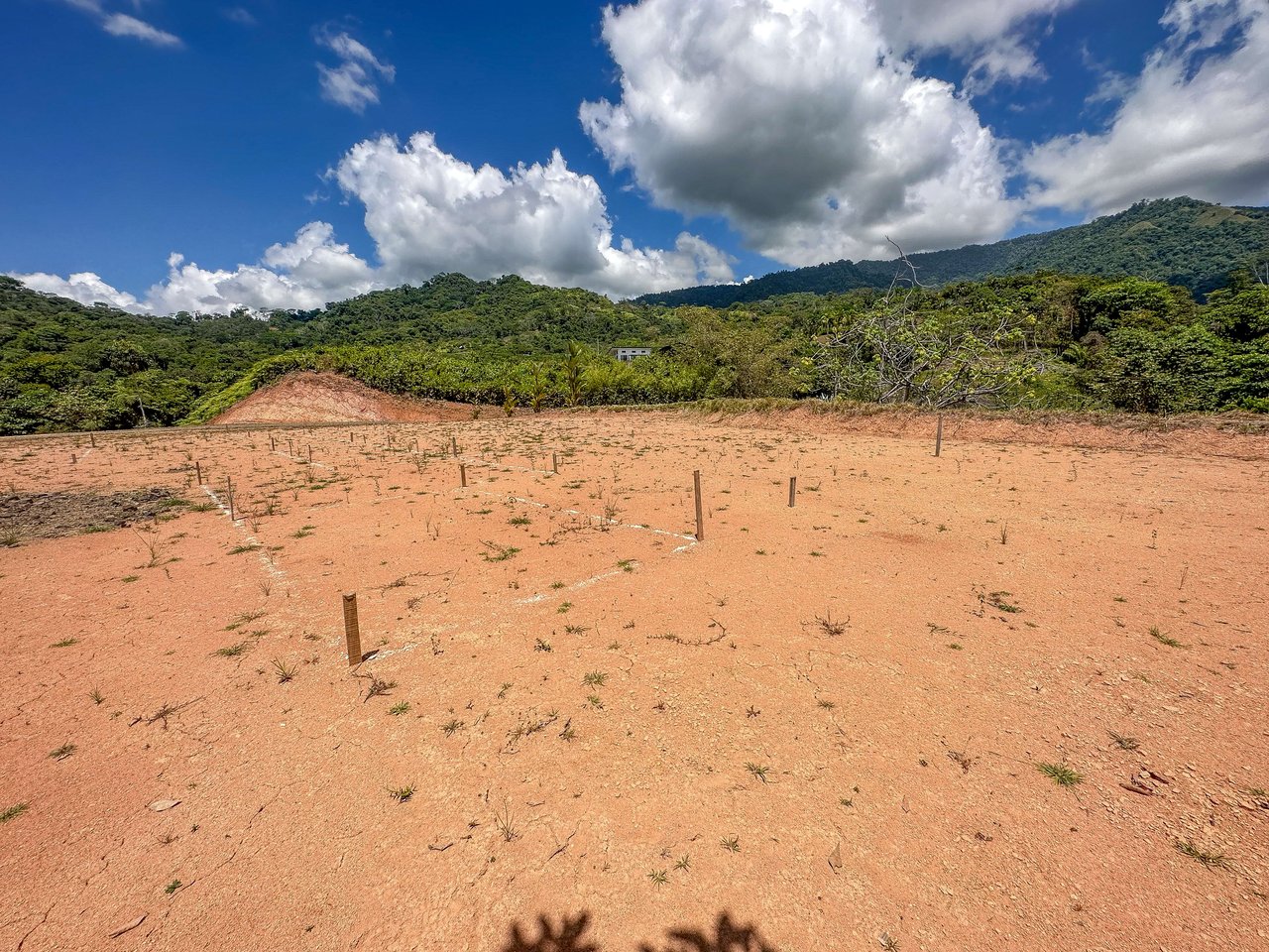 An elevated, prepared river lot with 360-degree ocean, mountain, valley and jungle views