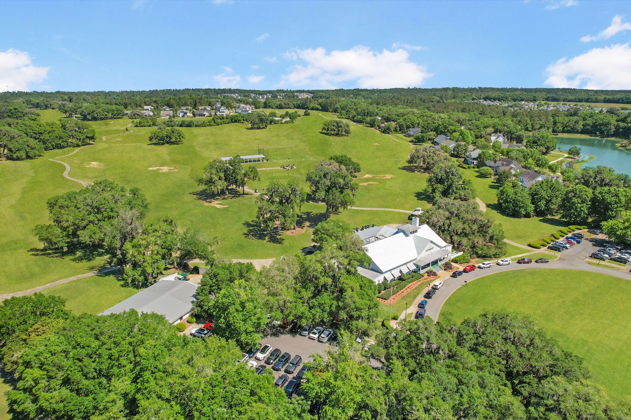 An aerial view of a large green area in Southwood with open fields, trees, and some buildings, likely a community park or recreational area