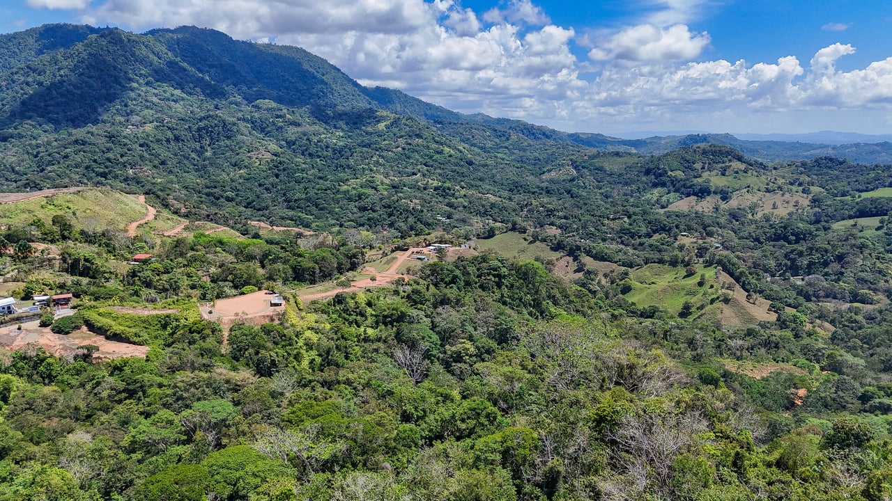 An elevated, prepared river lot with 360-degree ocean, mountain, valley and jungle views