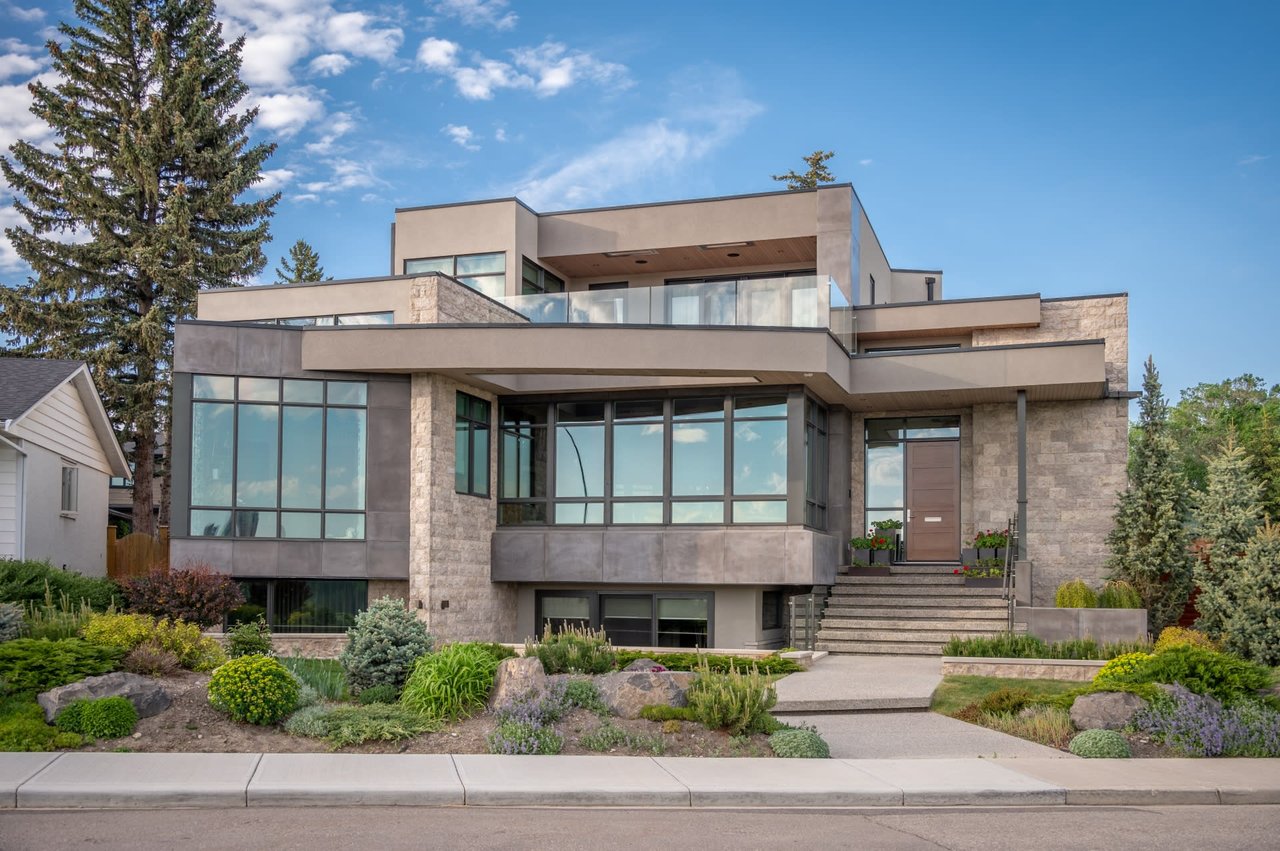  A wide shot of a modern, multi-level house with a striking contemporary design. 