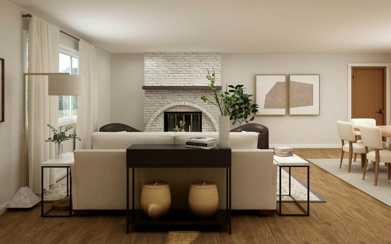 Living room with a white brick fireplace, neutral seating, and warm wood floors.