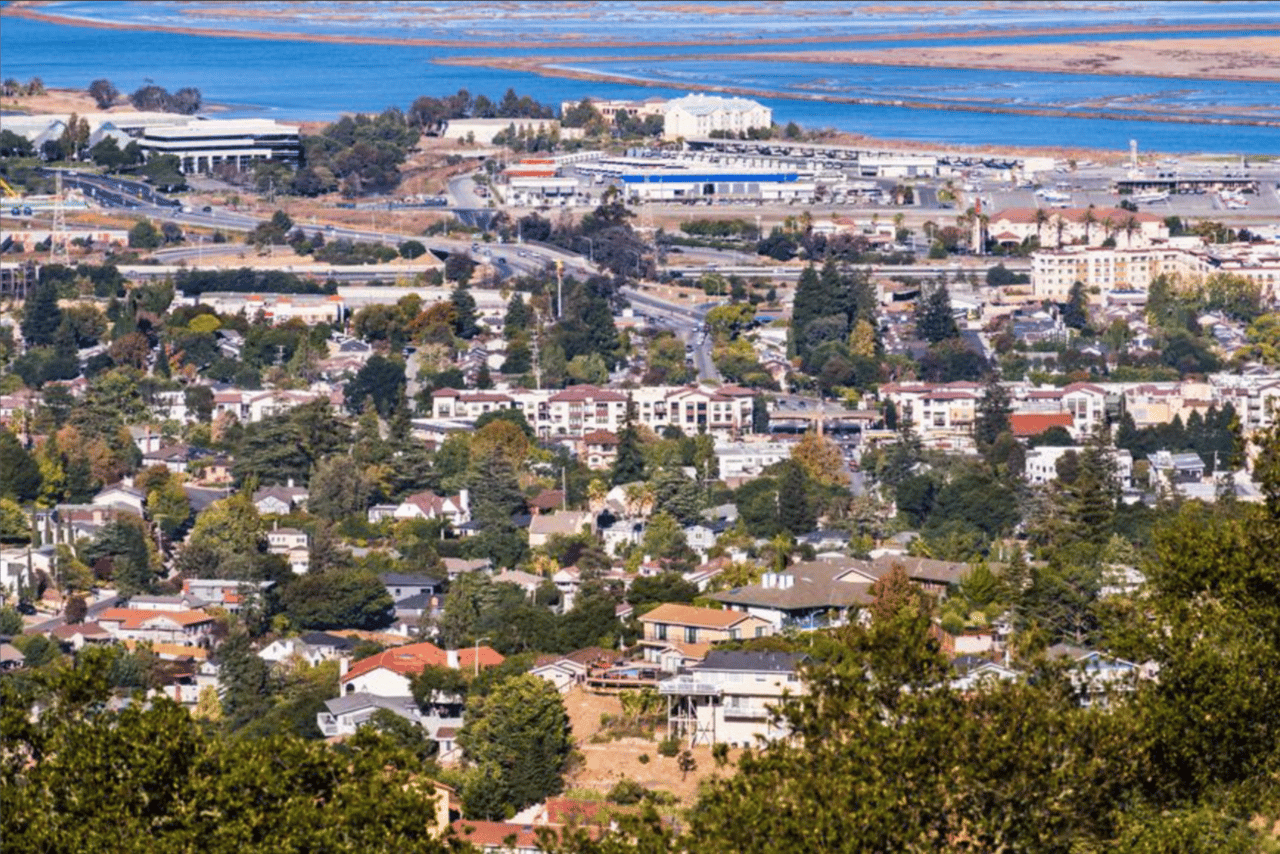 San Carlos city shot from the air with water in the background,single family homes and multi units shown 