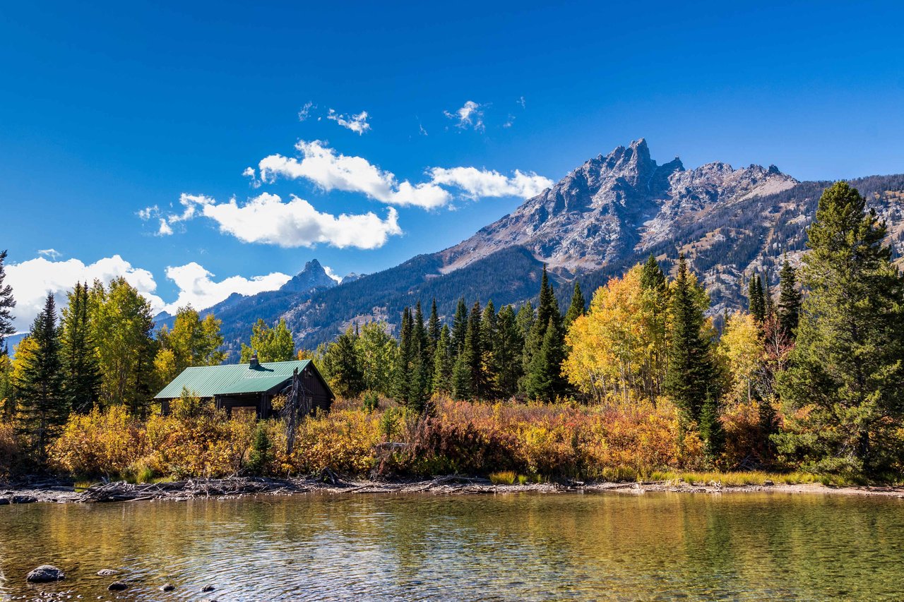 Stunning Jackson Hole home with mountain views, highlighting the financial benefits of buying real estate and becoming a Wyoming resident with no state income tax.