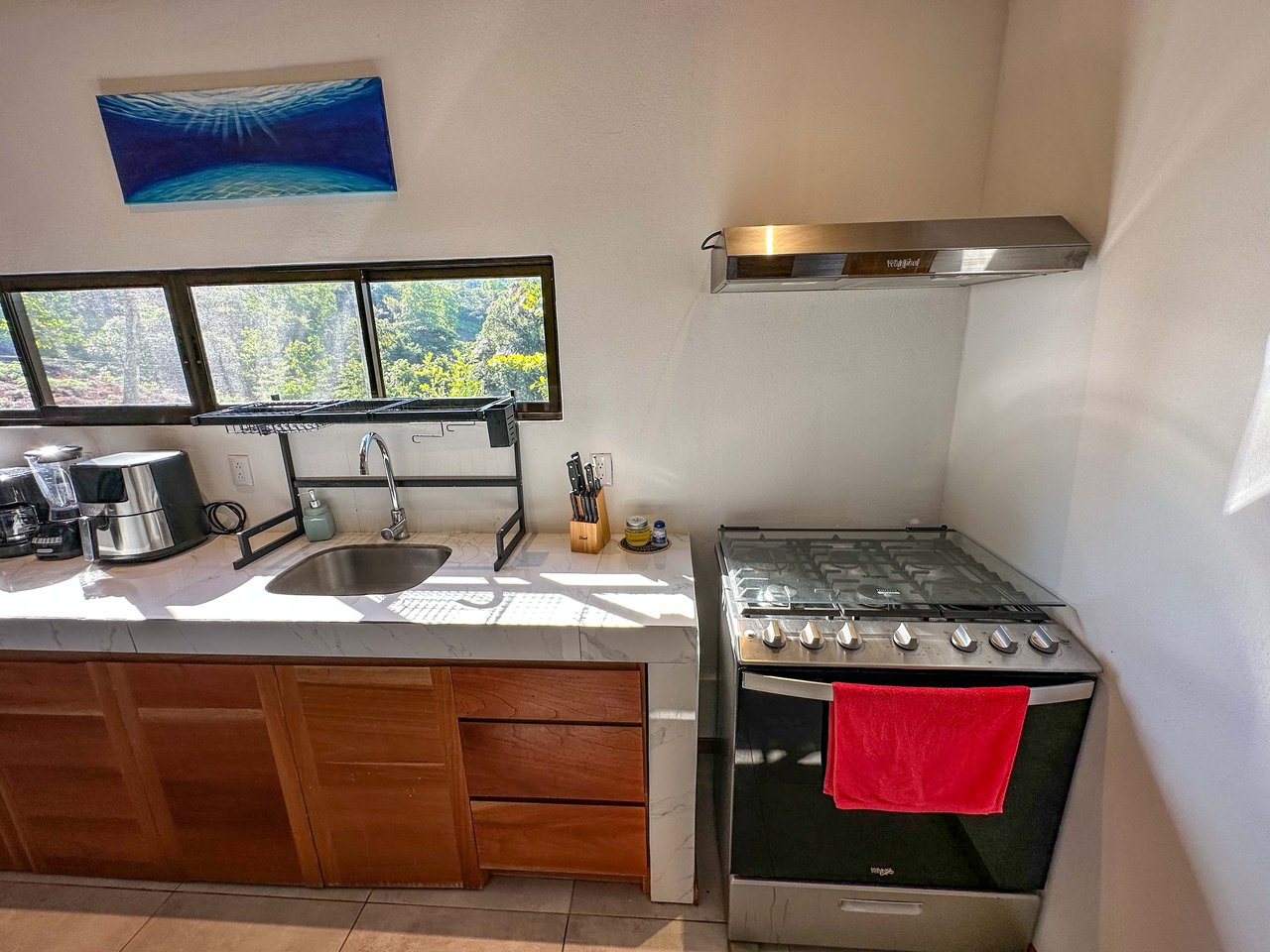 A 1-bedroom loft PERFECT for a couple or an Airbnb rental – plus a HUGE jungle backyard with a year-round river and many magical swimming holes – and a lot of flat land for further development!