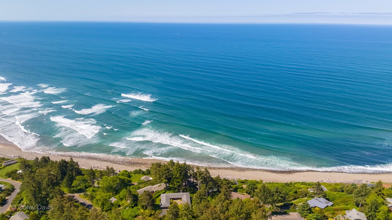 aerial view of the waves coming into neahkahnie beach