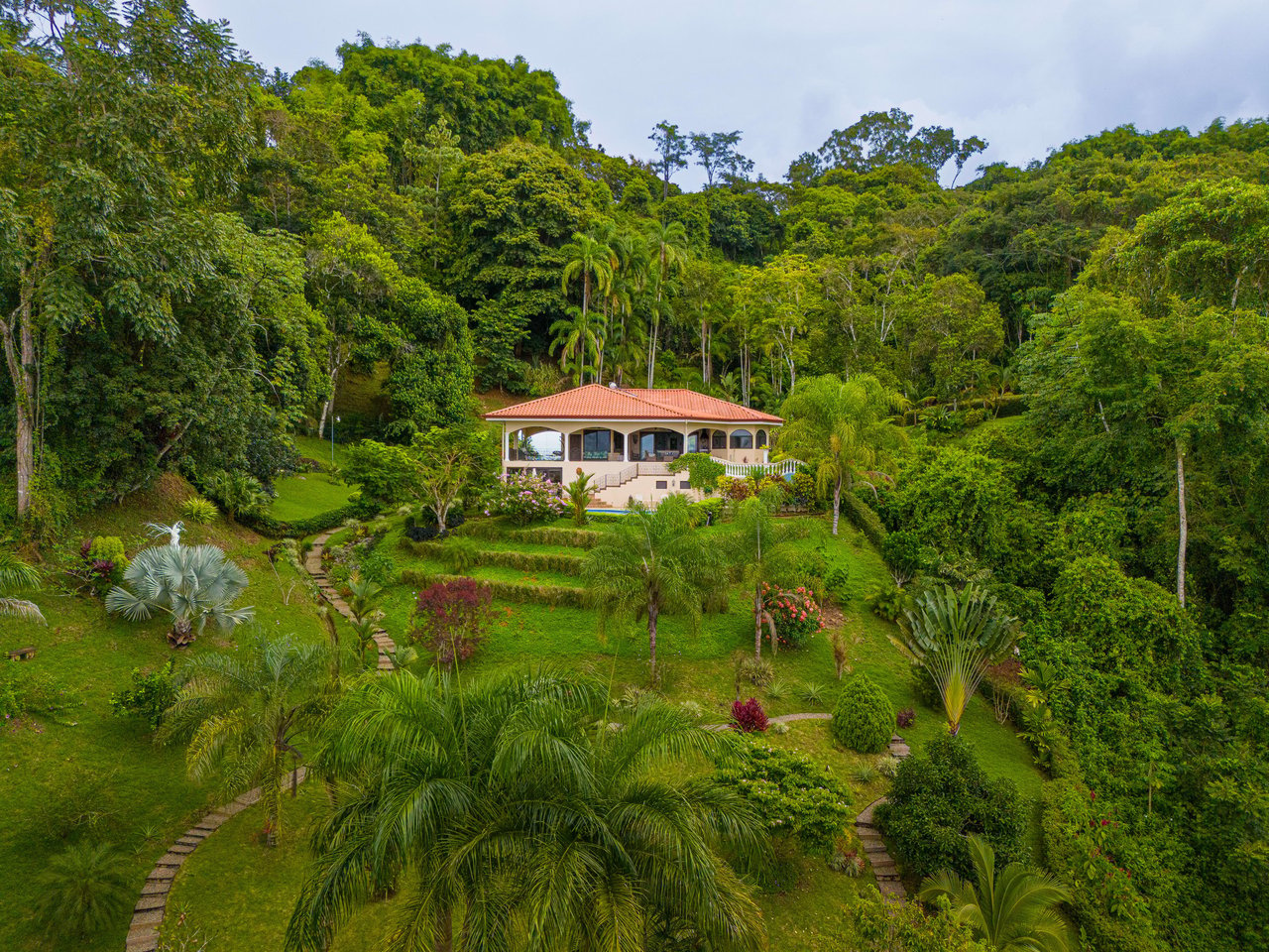 Beautiful 4500 sq ft home on 3.5 acres, gated community, expansive ocean, valley, and jungle views!