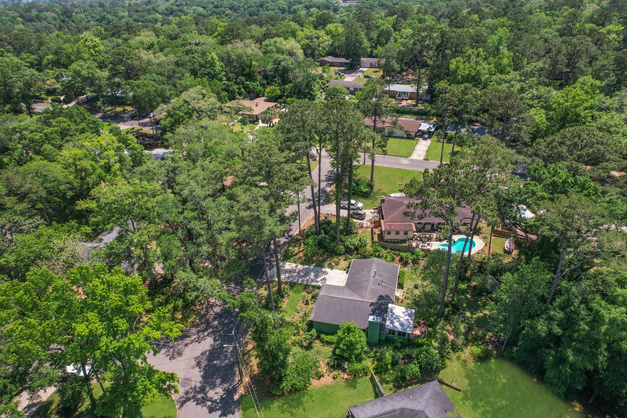 Another view of Town and Country, showcasing the layout of houses, yards, and the surrounding natural environment.