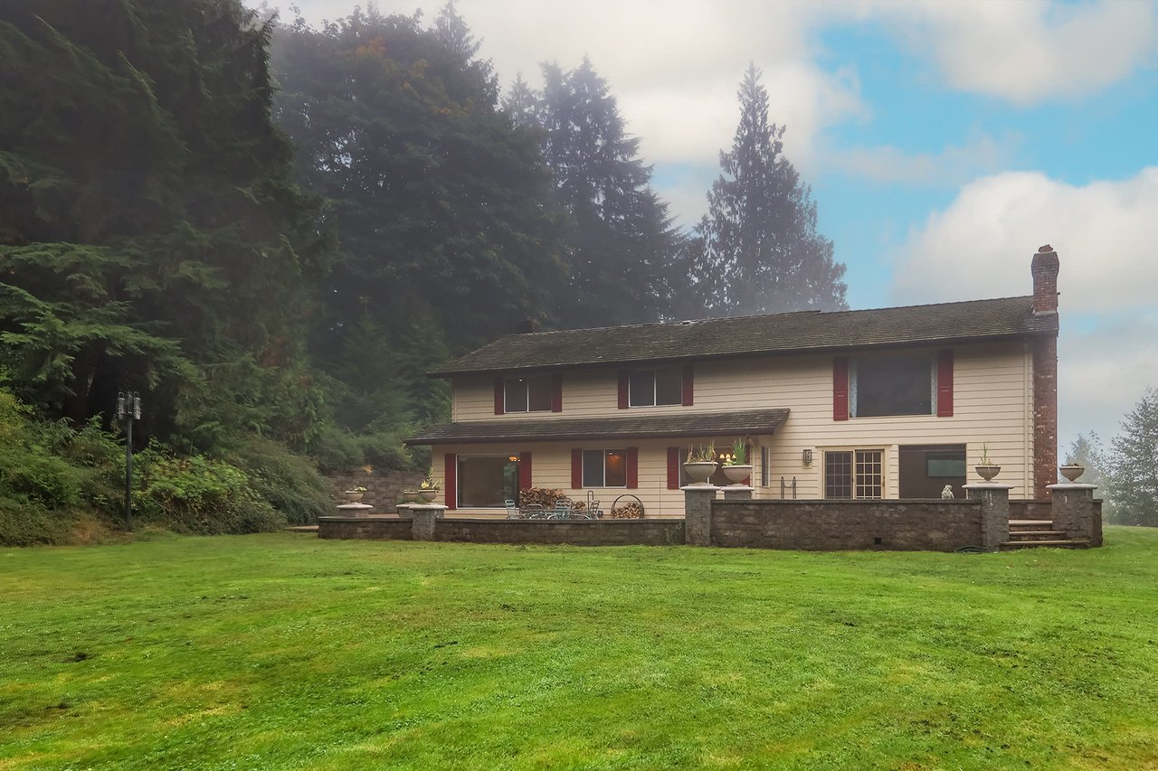 The patio gracefully extends the depth of the home, offering a spacious and versatile outdoor living area, ideal for hosting, dining, and soaking in the serene surroundings.