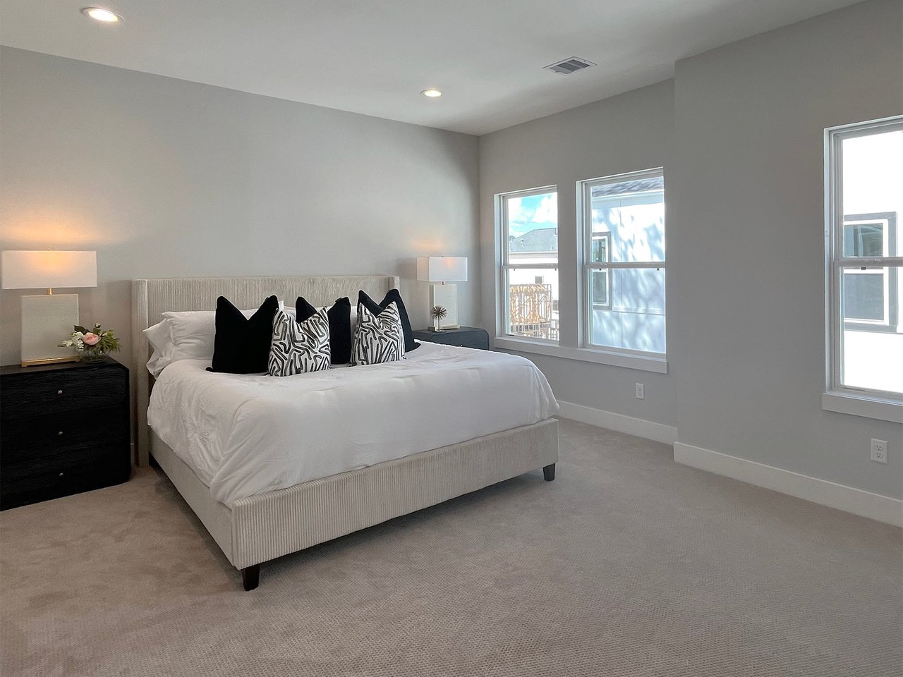 master bedroom with a king size bed