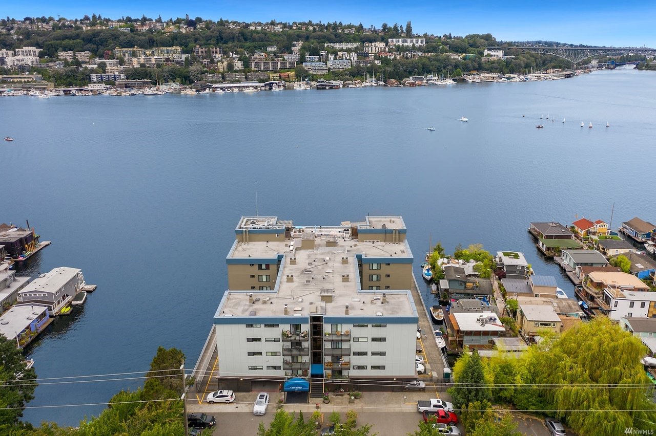 Contemporary waterfront condos with a rooftop deck nestled in a lively neighborhood with scenic lake views.