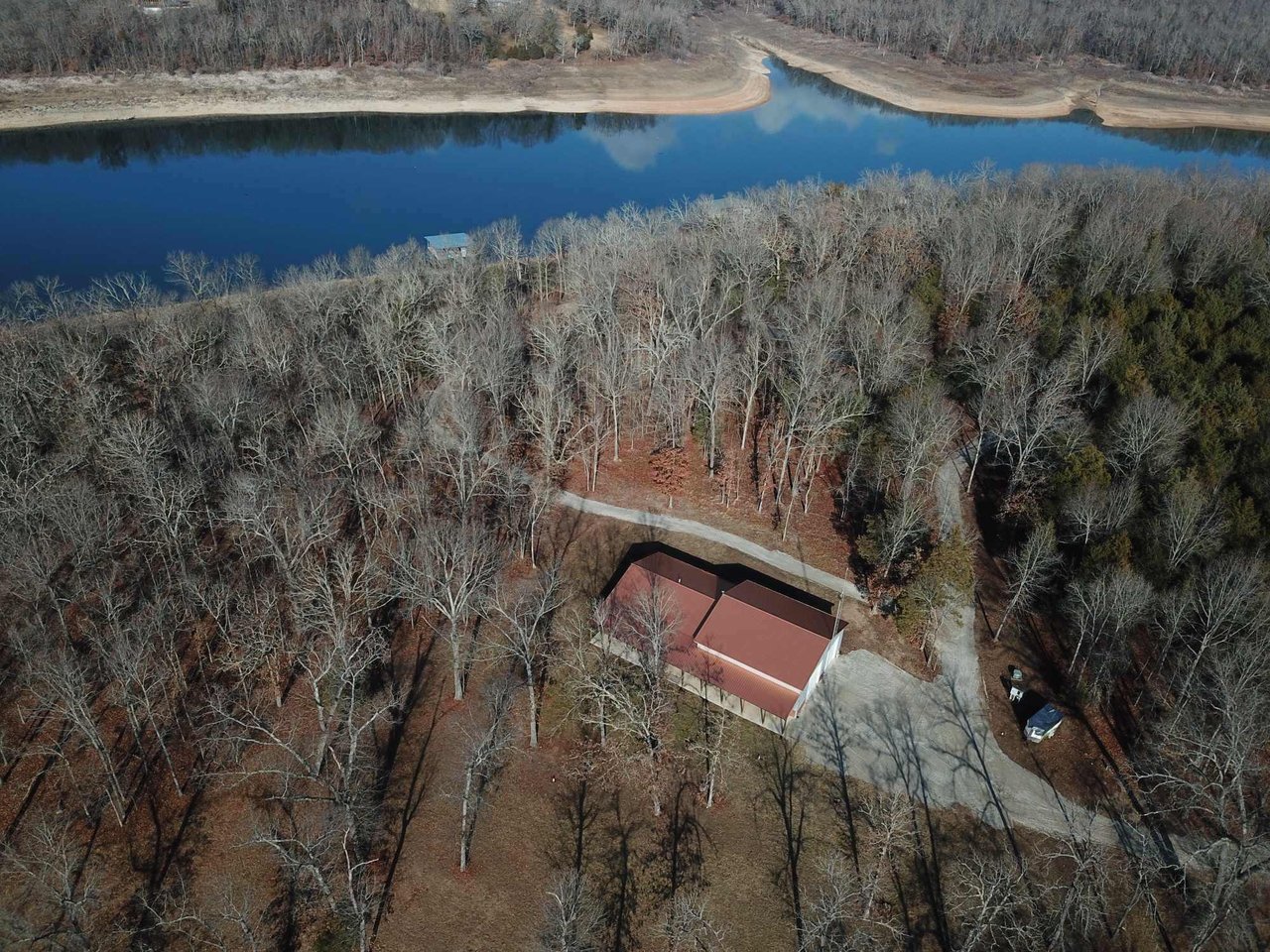 Photo of the home with the private 2 slip dock on 16.5 acres