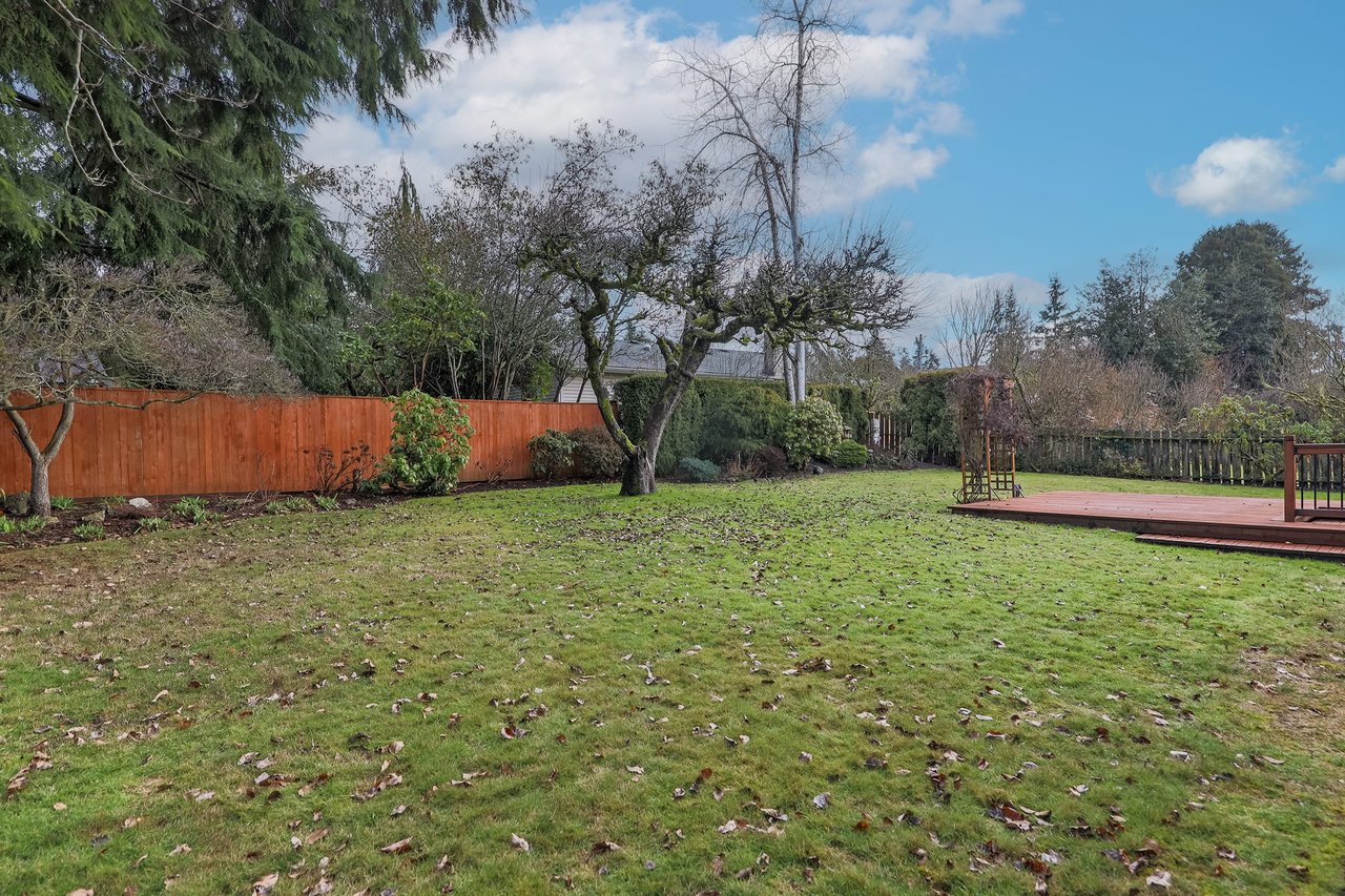 Enjoy a level backyard providing both space for play and a private sanctuary, combining fun and tranquility in one harmonious outdoor setting.