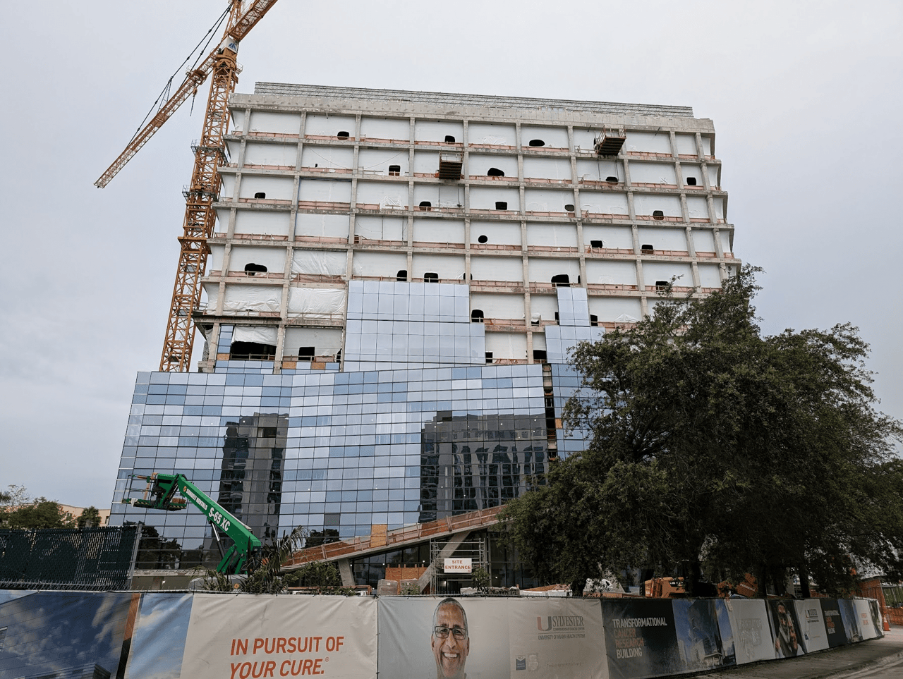 July 2024 - Glass Installation Underway at UM Cancer Center Being Built in Health District
