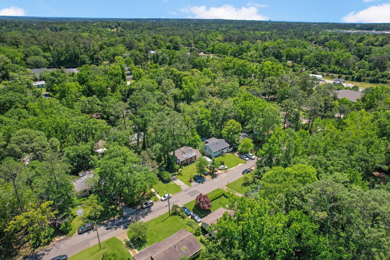 Another aerial view of the Capital Hills neighborhood, highlighting the residential layout and surrounding trees.