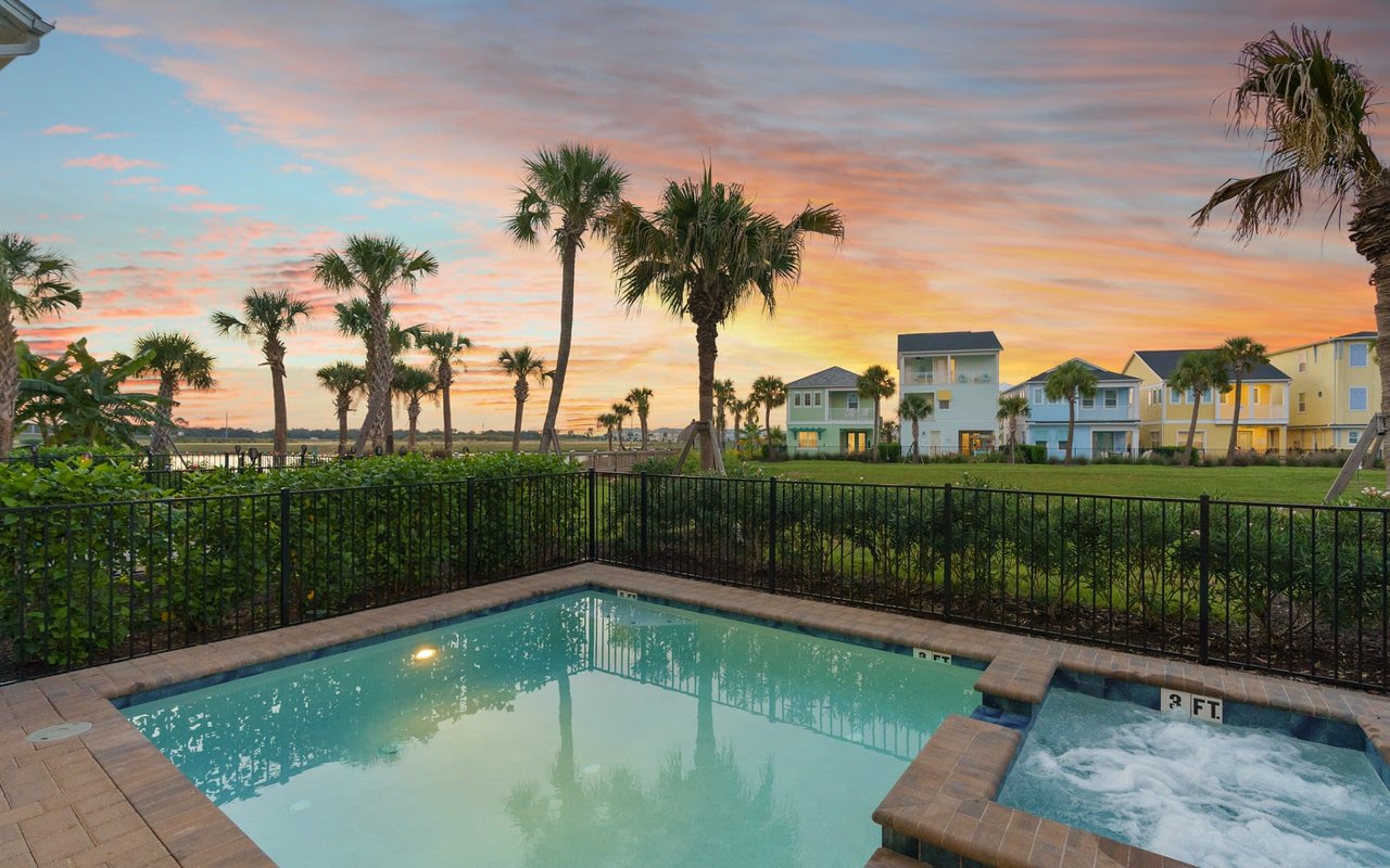 A beautiful sunset from the backyard pool of a Margaritaville Resort Orlando cottage