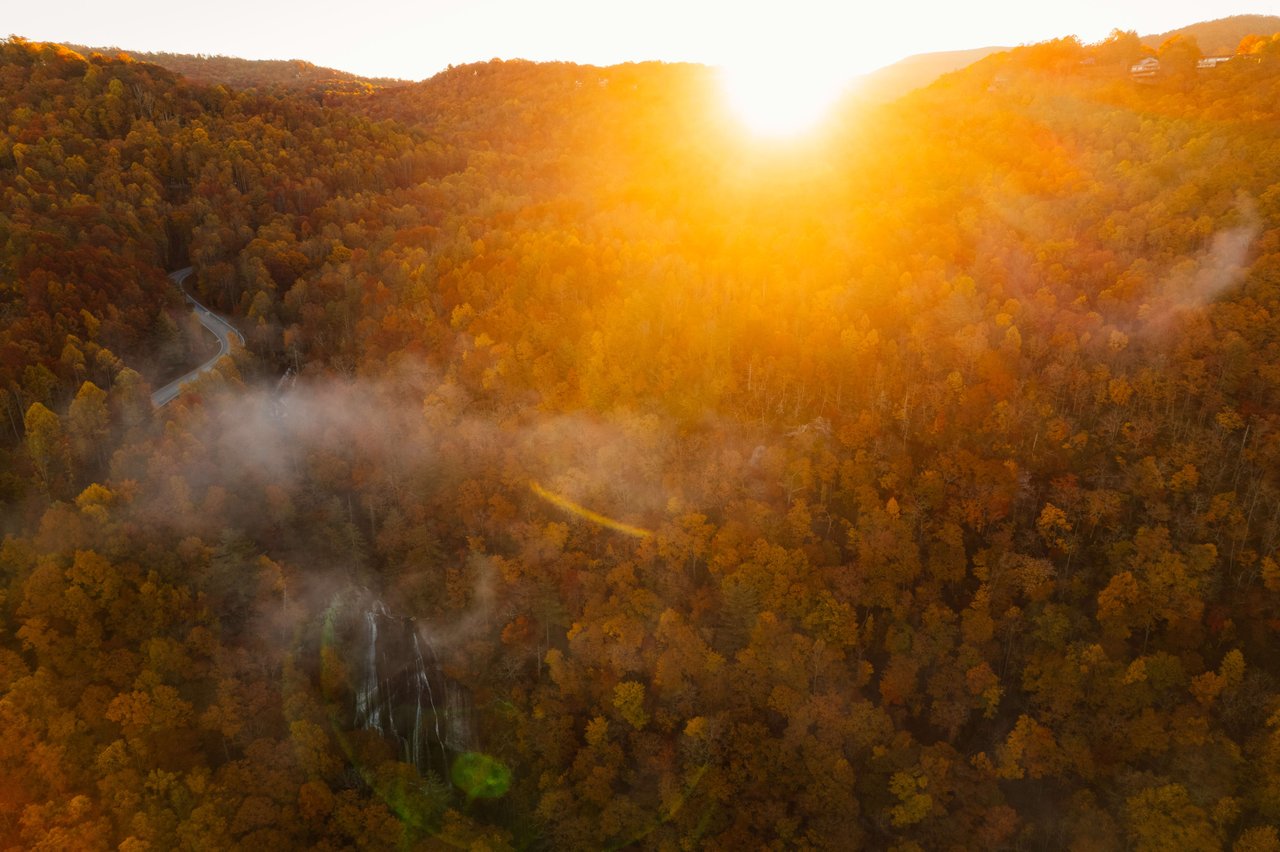 gigantic ball of sunshine peaking over the mountain tops in silva north carolina
