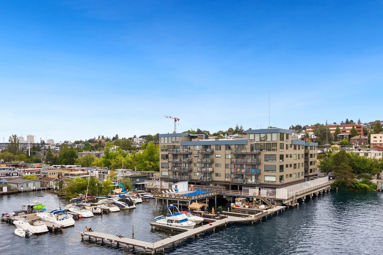 Lakeside condo residence with boat docks, offering a blend of leisure and luxury living in a tranquil setting.