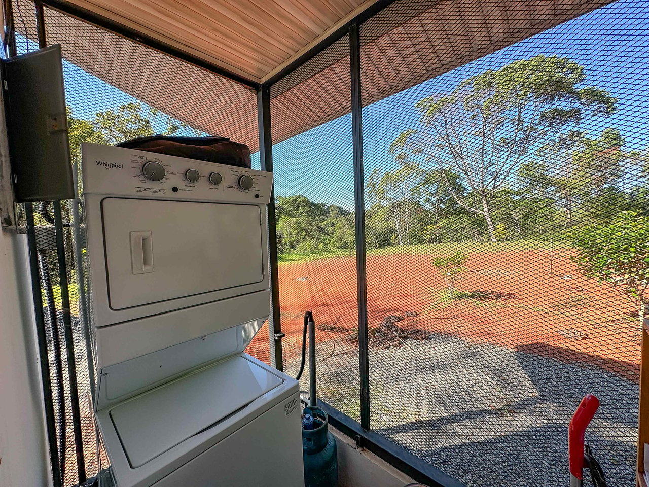 A 1-bedroom loft PERFECT for a couple or an Airbnb rental – plus a HUGE jungle backyard with a year-round river and many magical swimming holes – and a lot of flat land for further development!