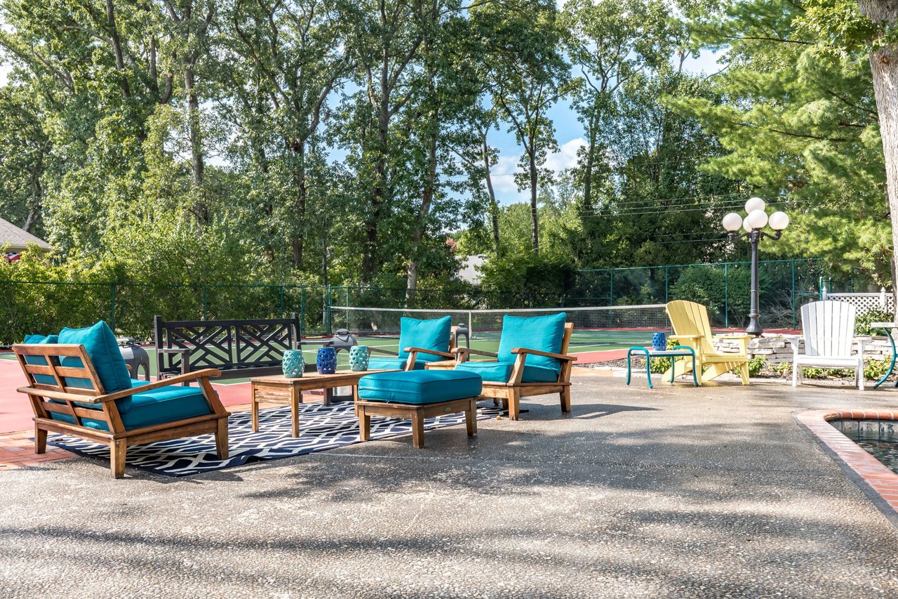 A Special Retreat on a Prized One Acre Lot With Pool and Tennis Court