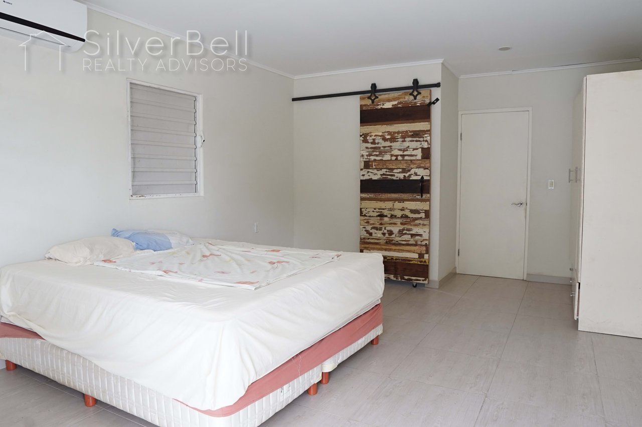 Welcome to this fully furnished apartment, located in Amandelweg, Dominguito, Curaçao where every bedroom is equipped with air conditioning and 5 minutes away from Mambo Beach. SilverBell Realty Advisors - Curaçao