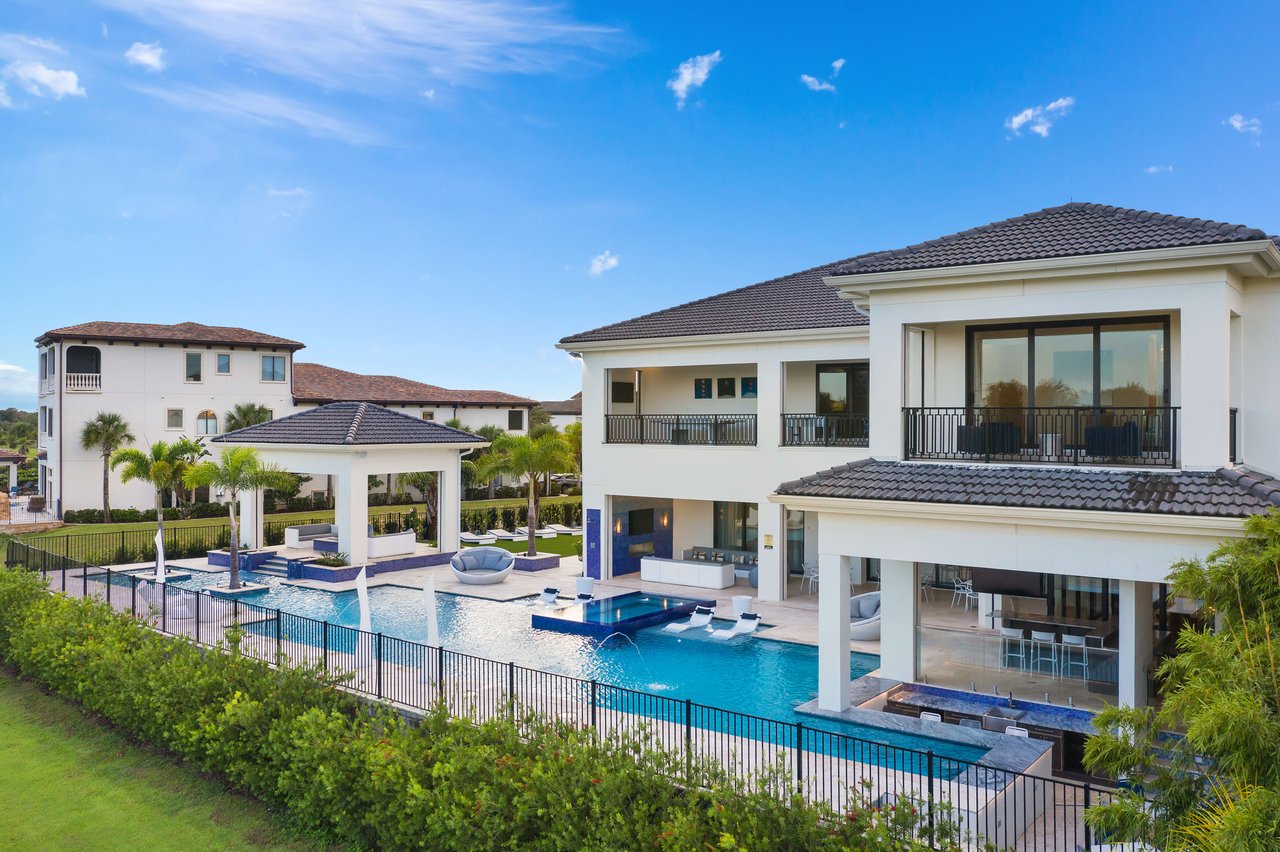 Expansive pool and backyard of a modern luxury vacation home in Reunion Resort