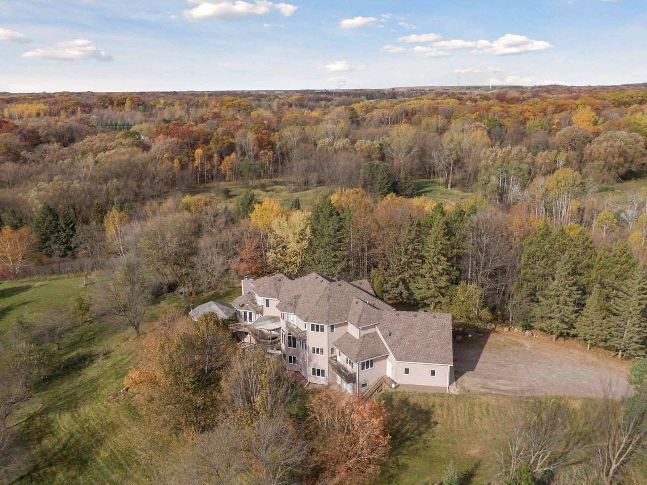 aerial view of a home in Andover MN surrounded by fall foliage, property sold by the A Good Life Group real estate team