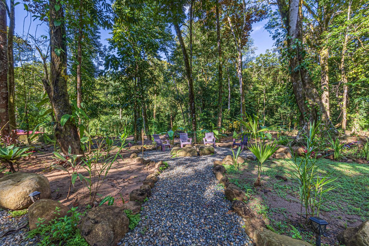 Versatile Riverfront Retreat: 5.3 Acre Rare Gem with Multiple Homes 