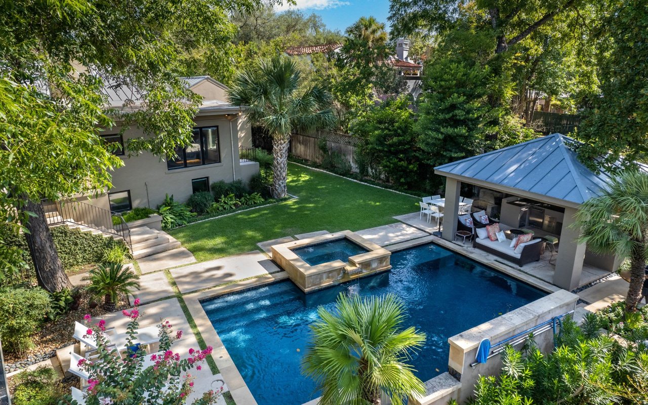 aerial photo of a luxury home with pool