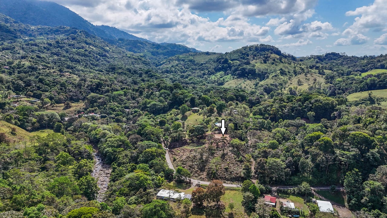 An elevated 1.2 acres lot with two plantels, panoramic mountain and jungle views.