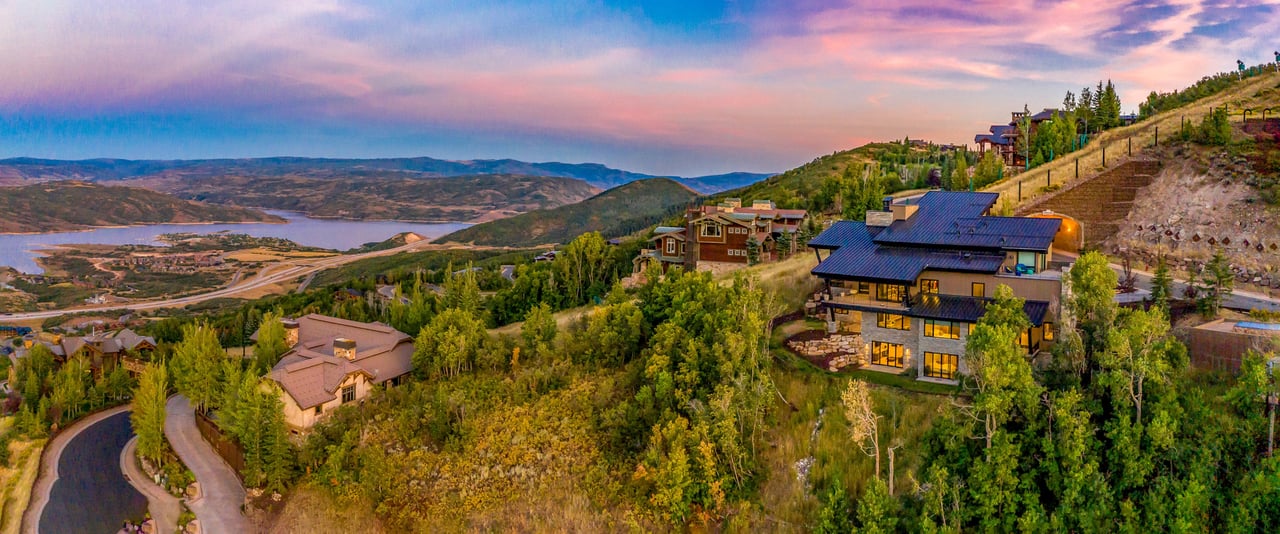 Aerial view of houses on a hillside at sunset