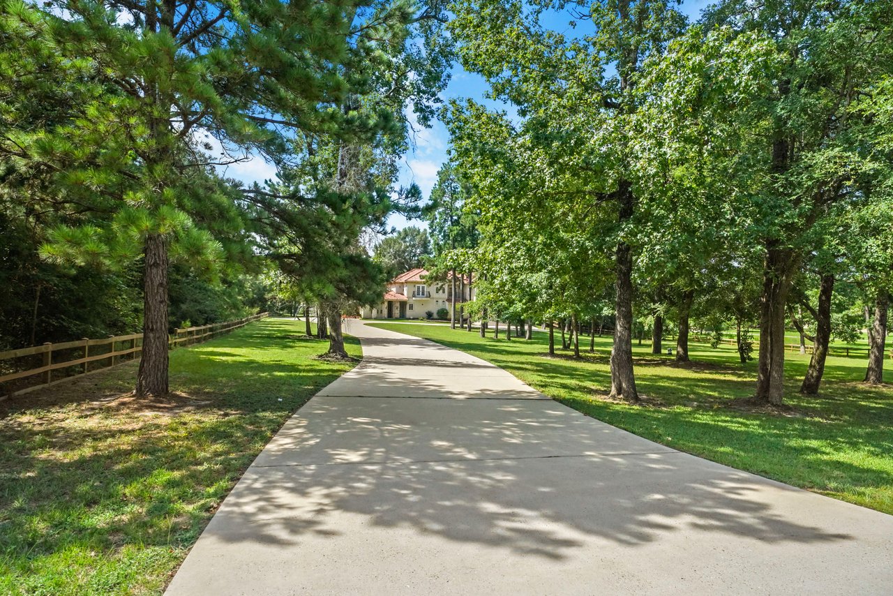 Long driveway to your waterfront estate! Plenty of room for guests at your next party!!