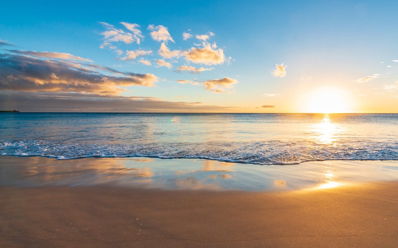 A white sand beach at sunset in Puako Hawaii