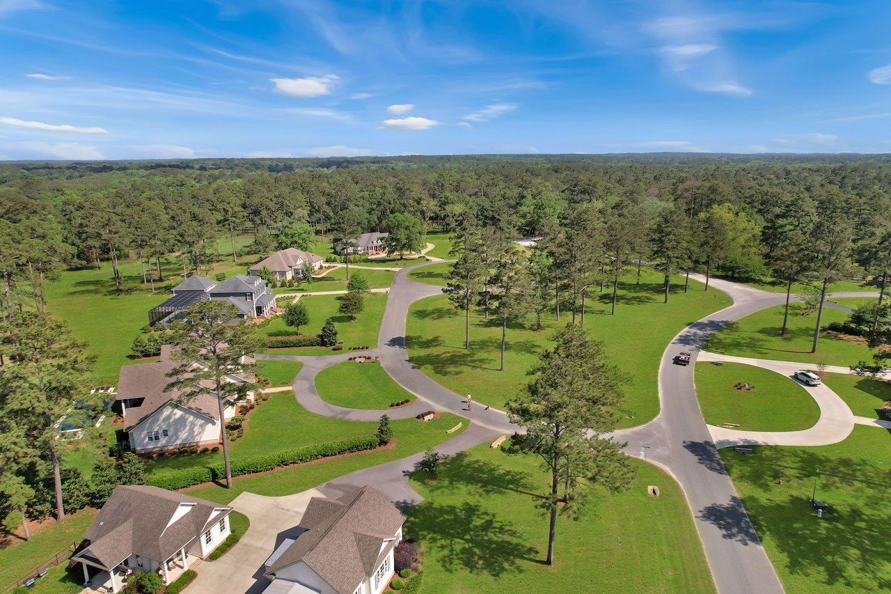 A ground-level view of the entrance sign for "Centerville Conservation Community," indicating the name of the residential community.