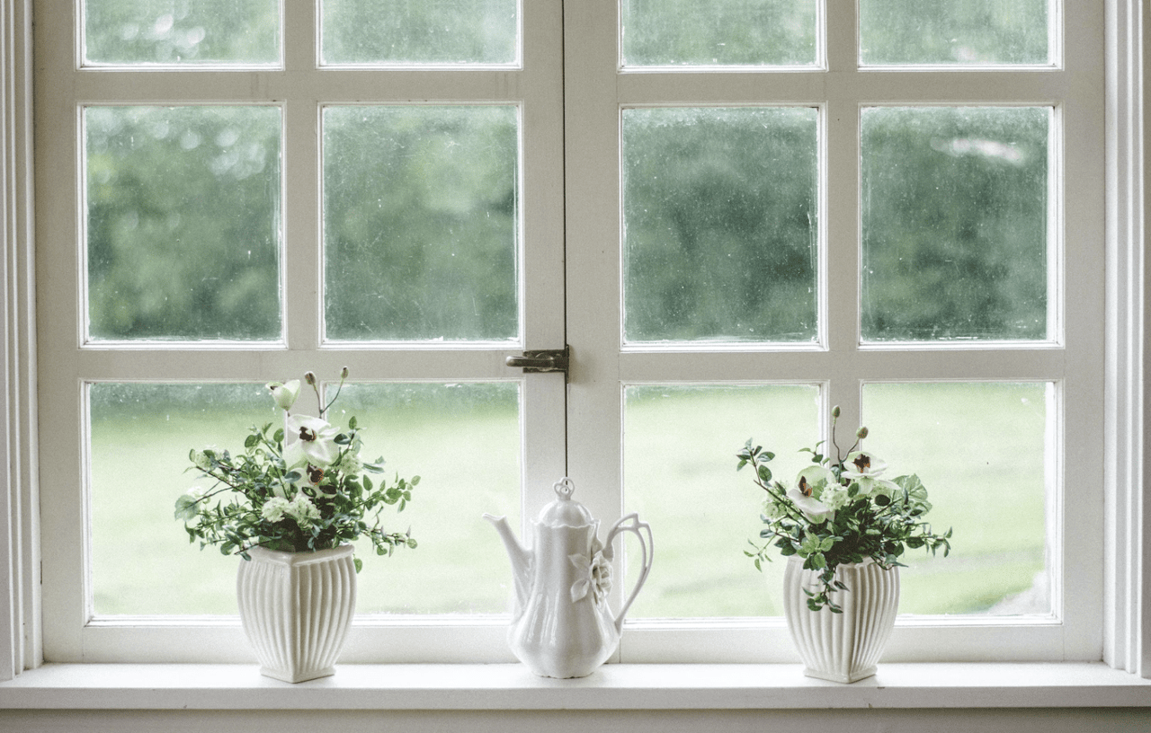 A window with white frames, consisting of three panels on the left and three panels on the right.