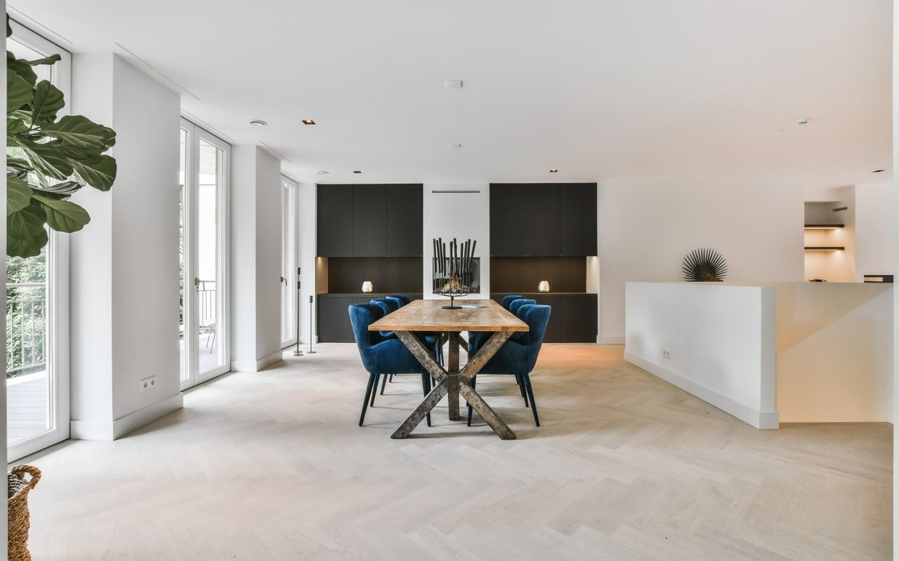 Bright modern dining room with a farmhouse table. Home tour videos from The Callander Group