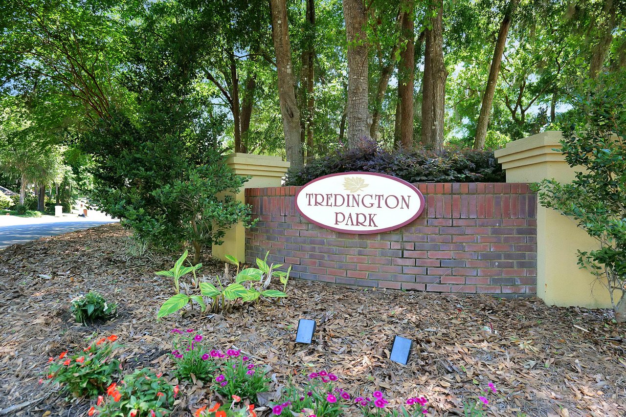 A ground-level view of a sign for "Tredington Park," indicating the entrance to a residential community.