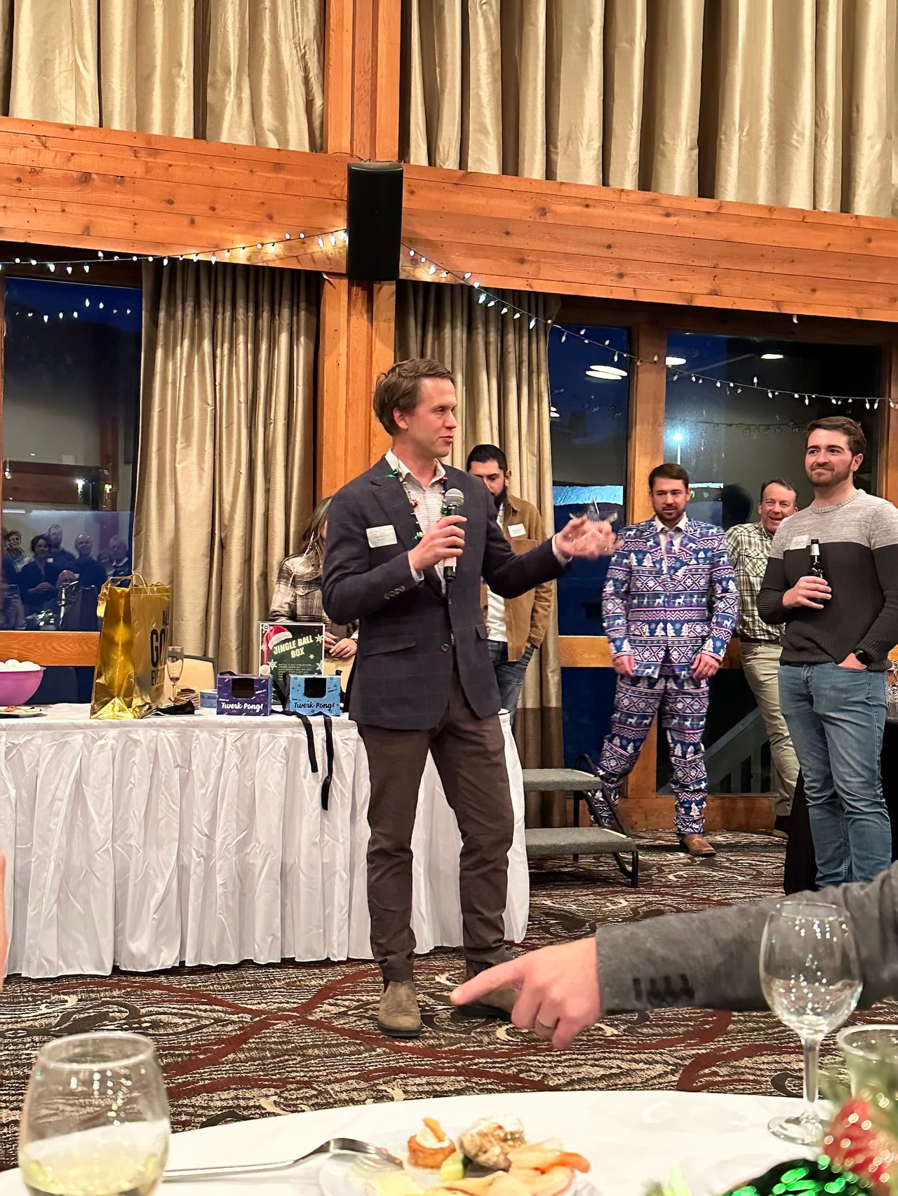 Photo of Greg Hahnel giving a speech at the Mountain Standard Realty Christmas party