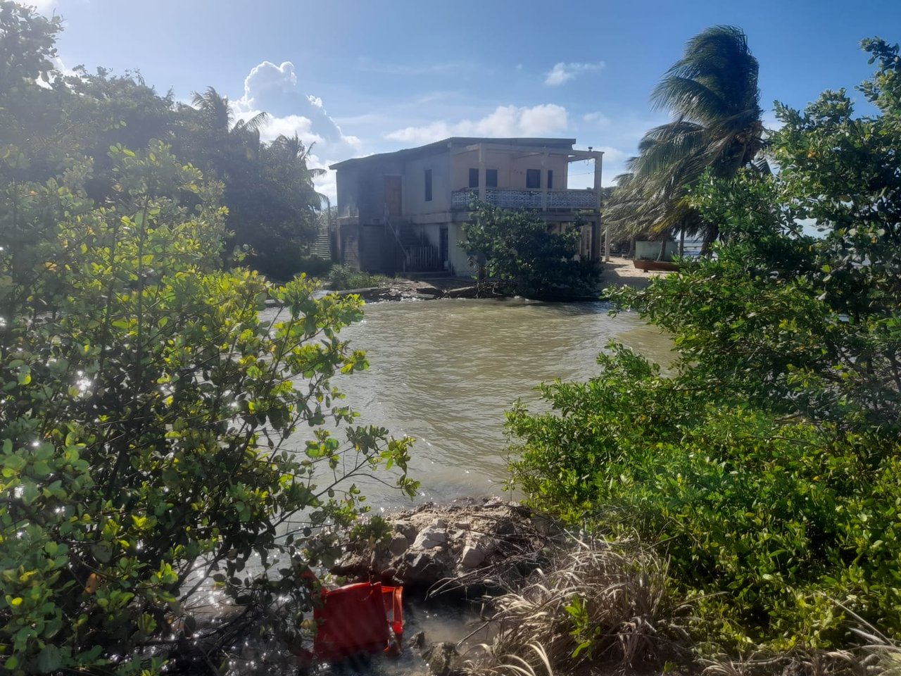 Charming 1.6 acre Caribbean Beachfront peninsular in Dangriga Town, Belize